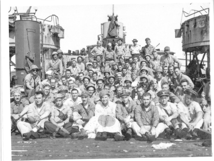 LST884_crew.jpg - LST 884 CrewNotice the many different uniforms, a result of the crews lose of almost everything in the fire. This picture was taken once the crew was reunited at Ulithi. (Lee family photo album)